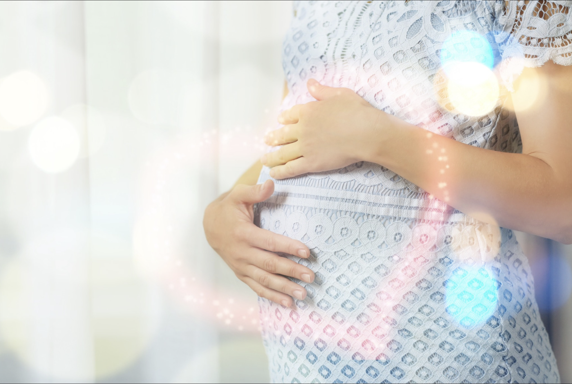 Pregnant woman holding her abdomen, reflecting personalised medical support during pregnancy at Phoenix Women’s Health.